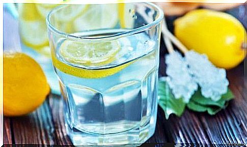 glass with water and lemons 