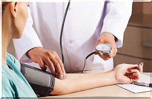 Doctor measures the pressure in patient