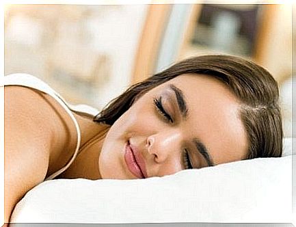 Smiling girl sleeping.