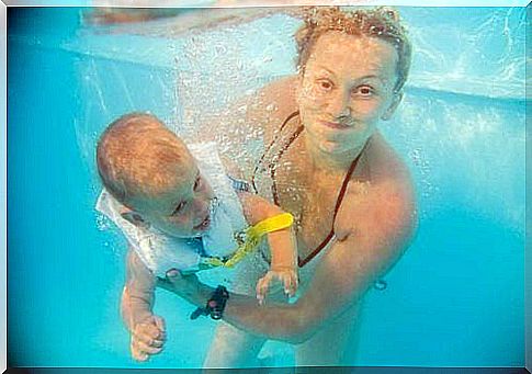 mom and baby in the pool 