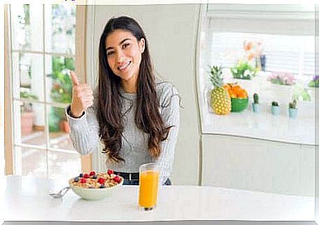 Girl in front of healthy breakfast.