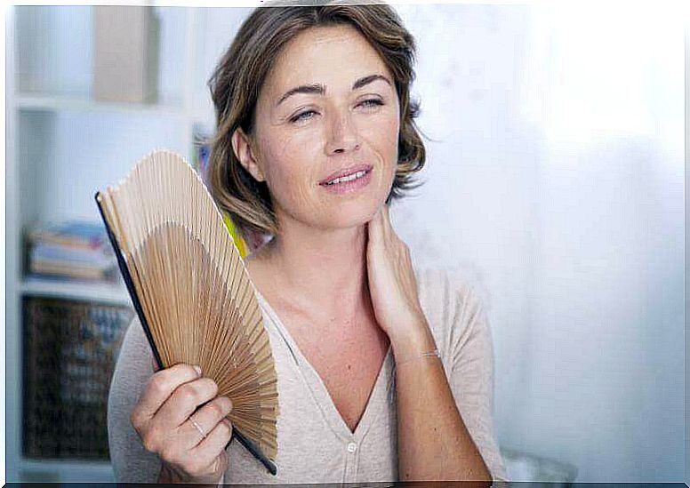 Menopausal woman with fan