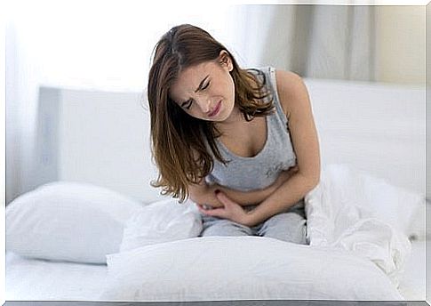 Woman laxative drink with stomach ache