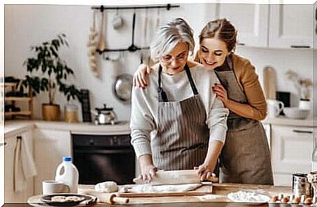 Woman cooking with mother between New Year resolutions.