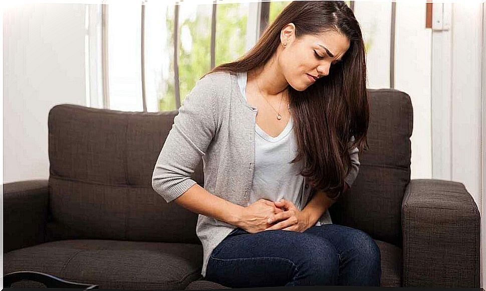 Suffering girl with hands on stomach