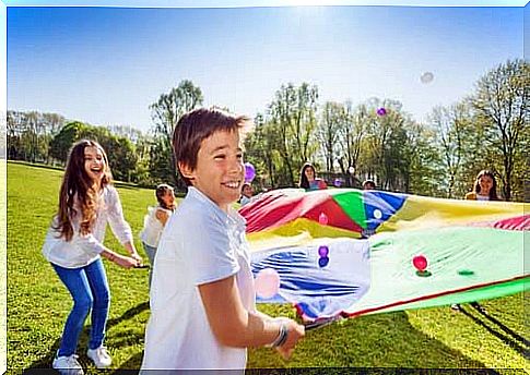 Kids on the lawn with a kite