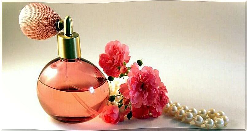 Perfume decorated with roses and pearls