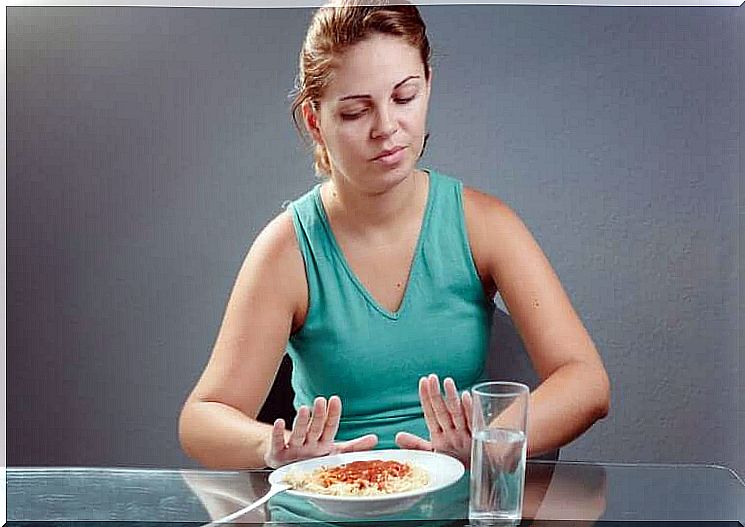 Woman refuses plate of pasta